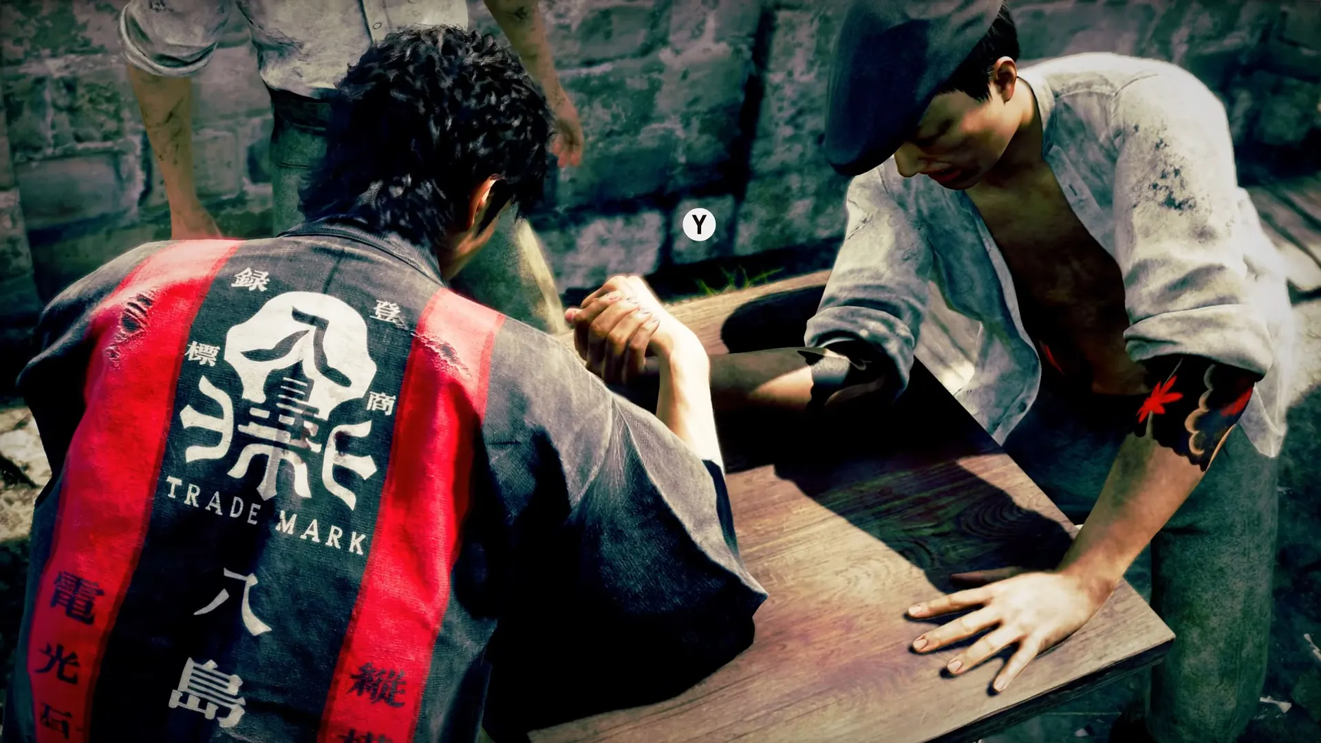 Makoto Daito arm wrestles during a side activity